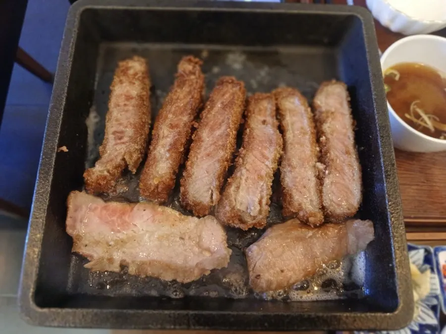 Gyukatsu being grilled in butter on the personal griddle