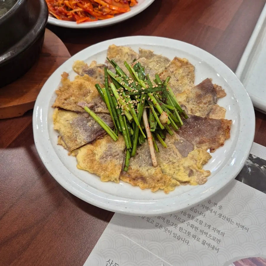 Mikodam beef jeon topped with chive salad