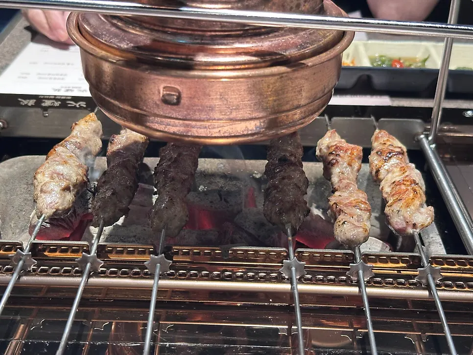 Stir-fried morning glory paired with lamb skewers
