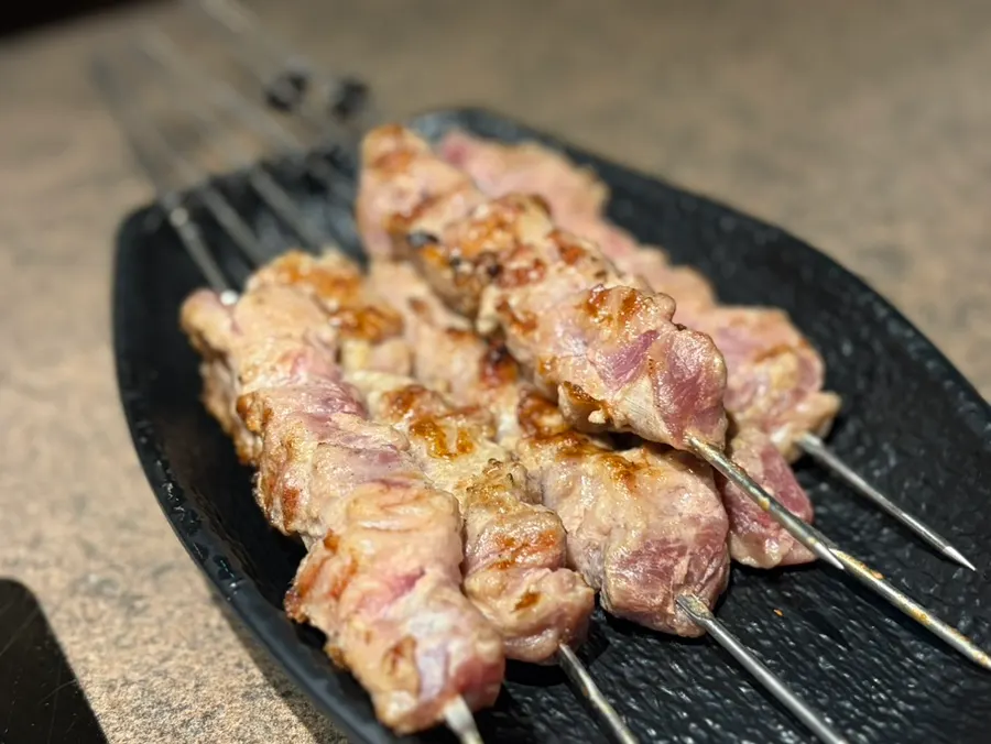 Enjoying the lamb chops during the meal