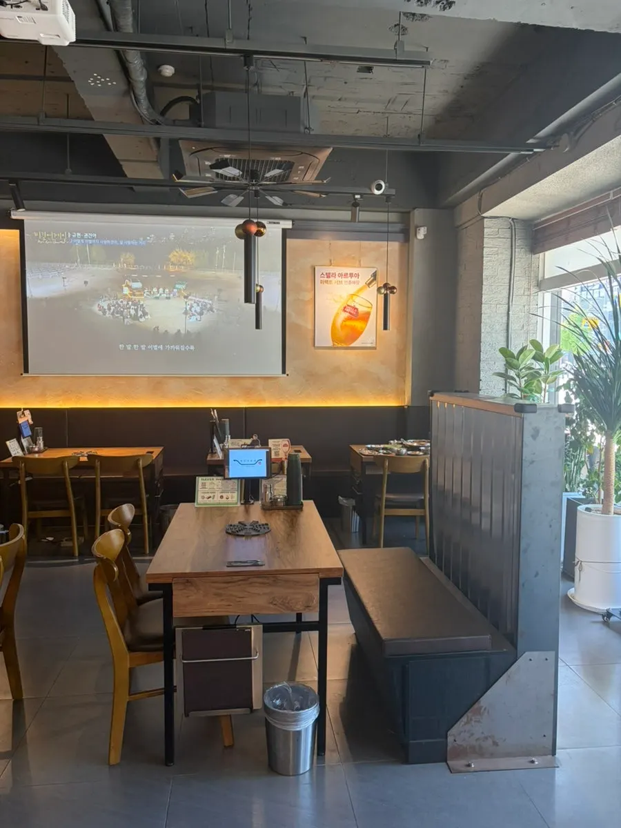 Interior of Gungmin Nakgopsae Gangseo Branch with wood-tone decor