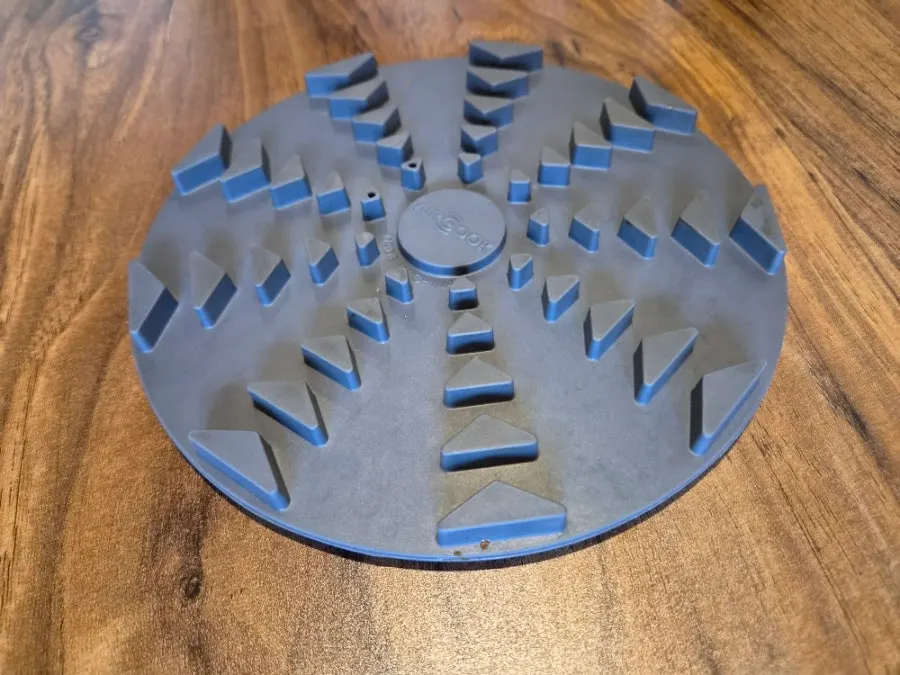 The round induction burner built into the table