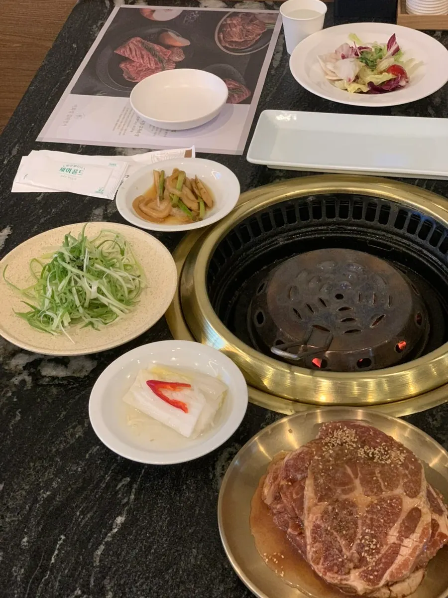 Pork ribs served with a spread of side dishes