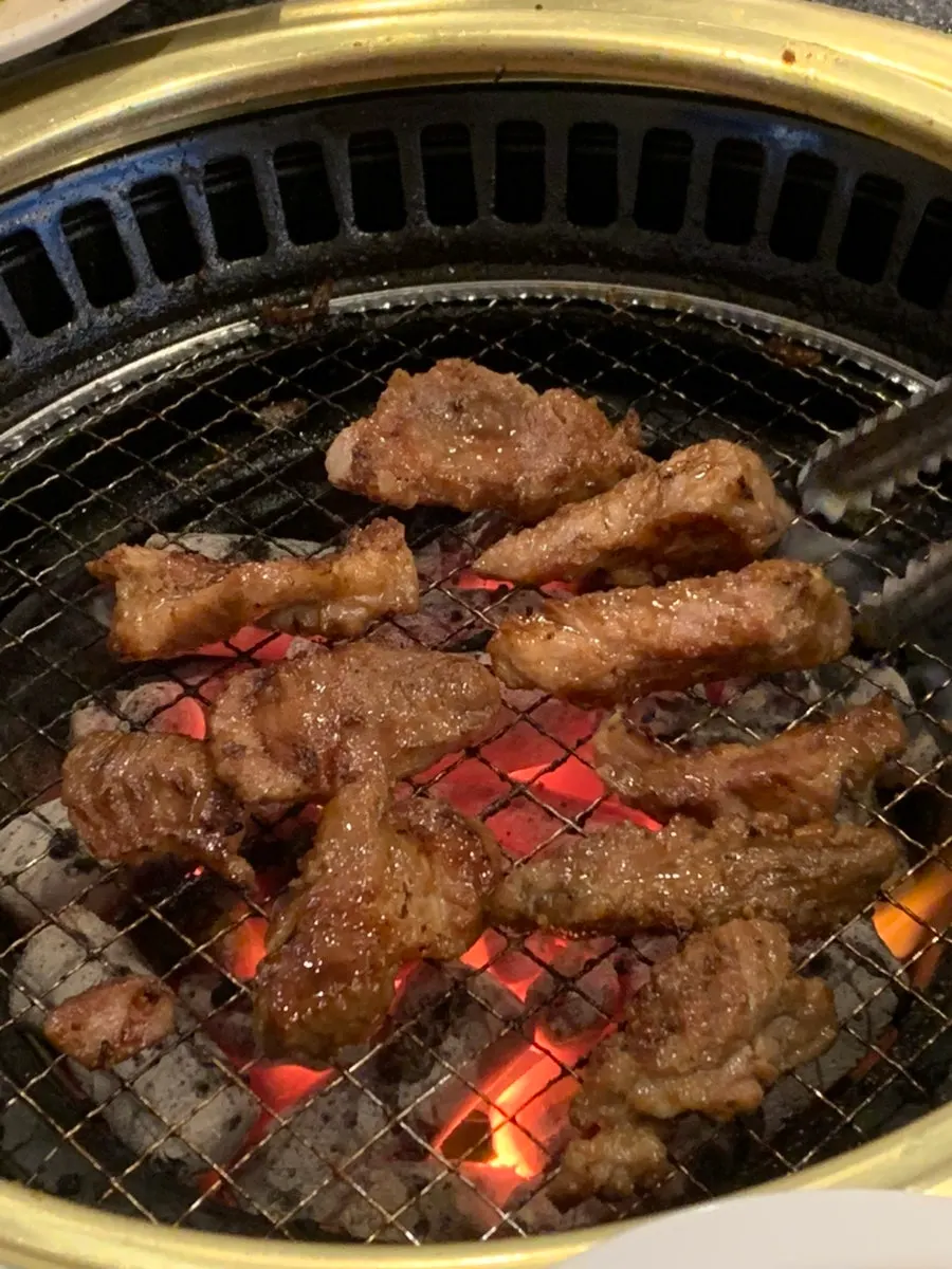 Close-up of pork ribs grilling on the fire