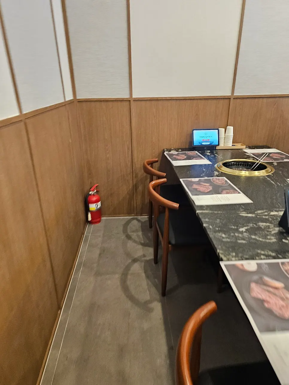 Large dining-hall table with a marble-like finish