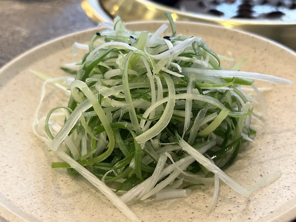 Plates of pickled vegetables and cabbage salad