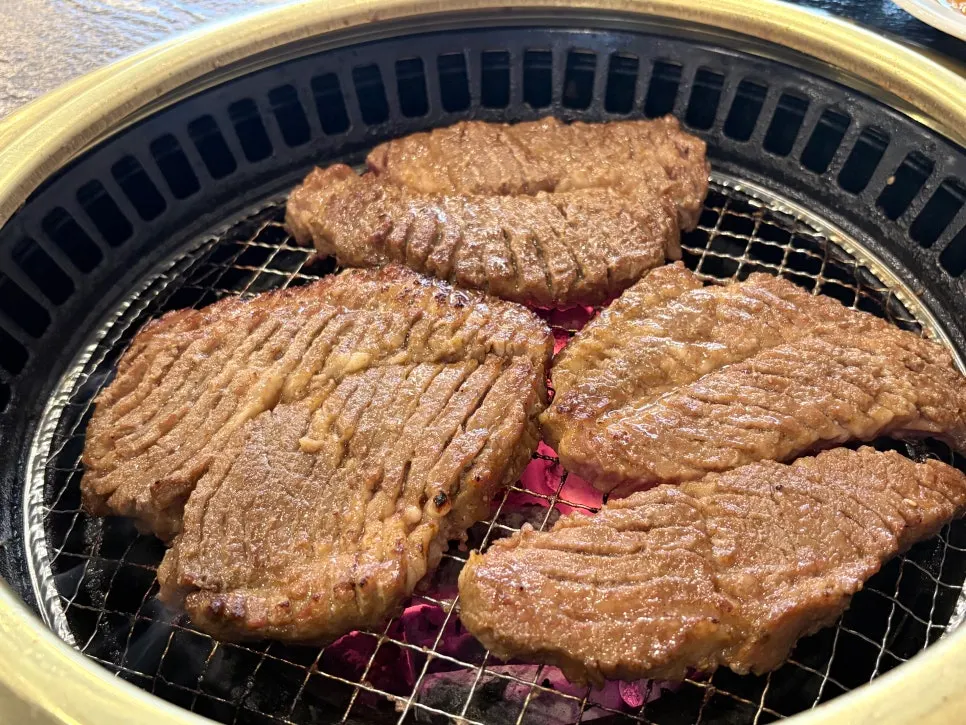 Pork ribs and scallion garnish on the grill