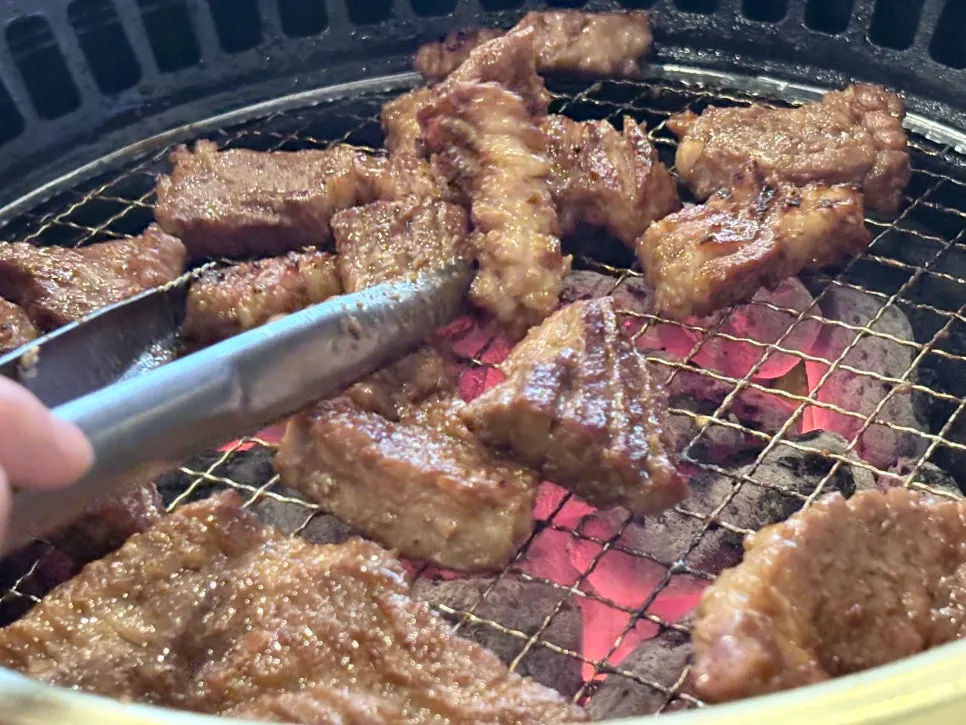 A piece of pork galbi eaten with side dishes