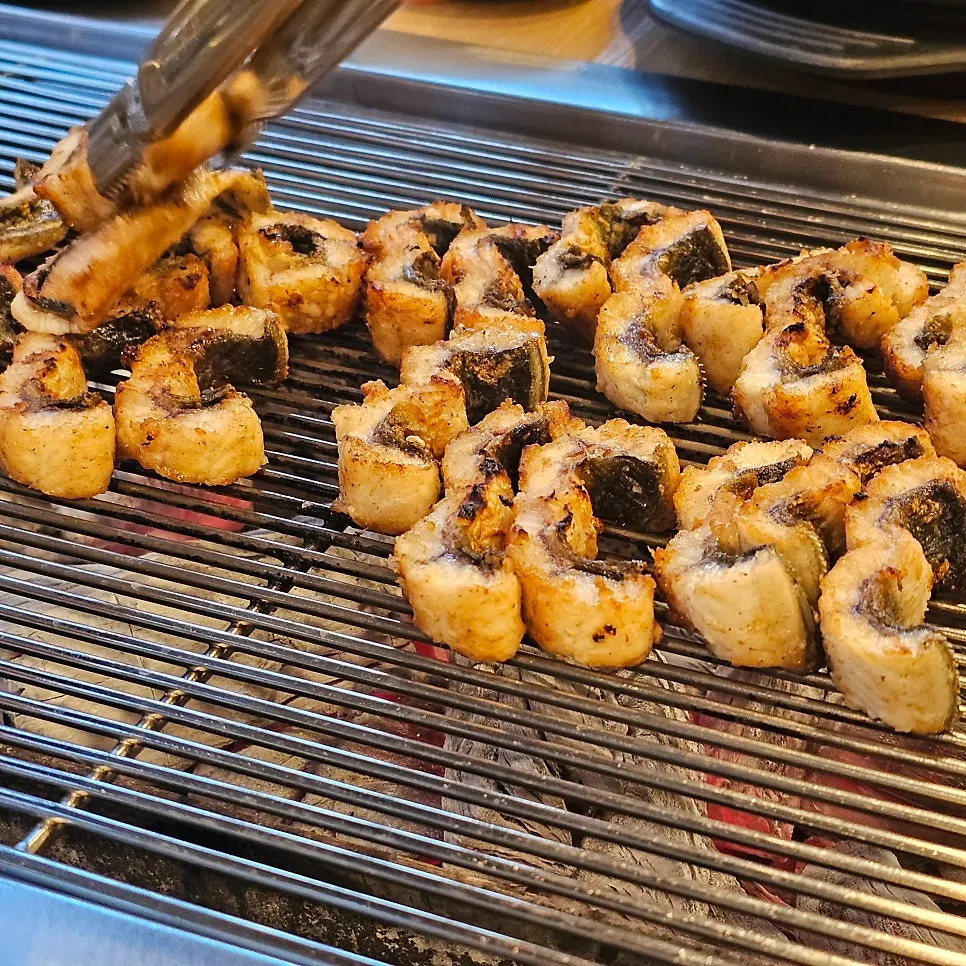 A piece of eel served with ginger