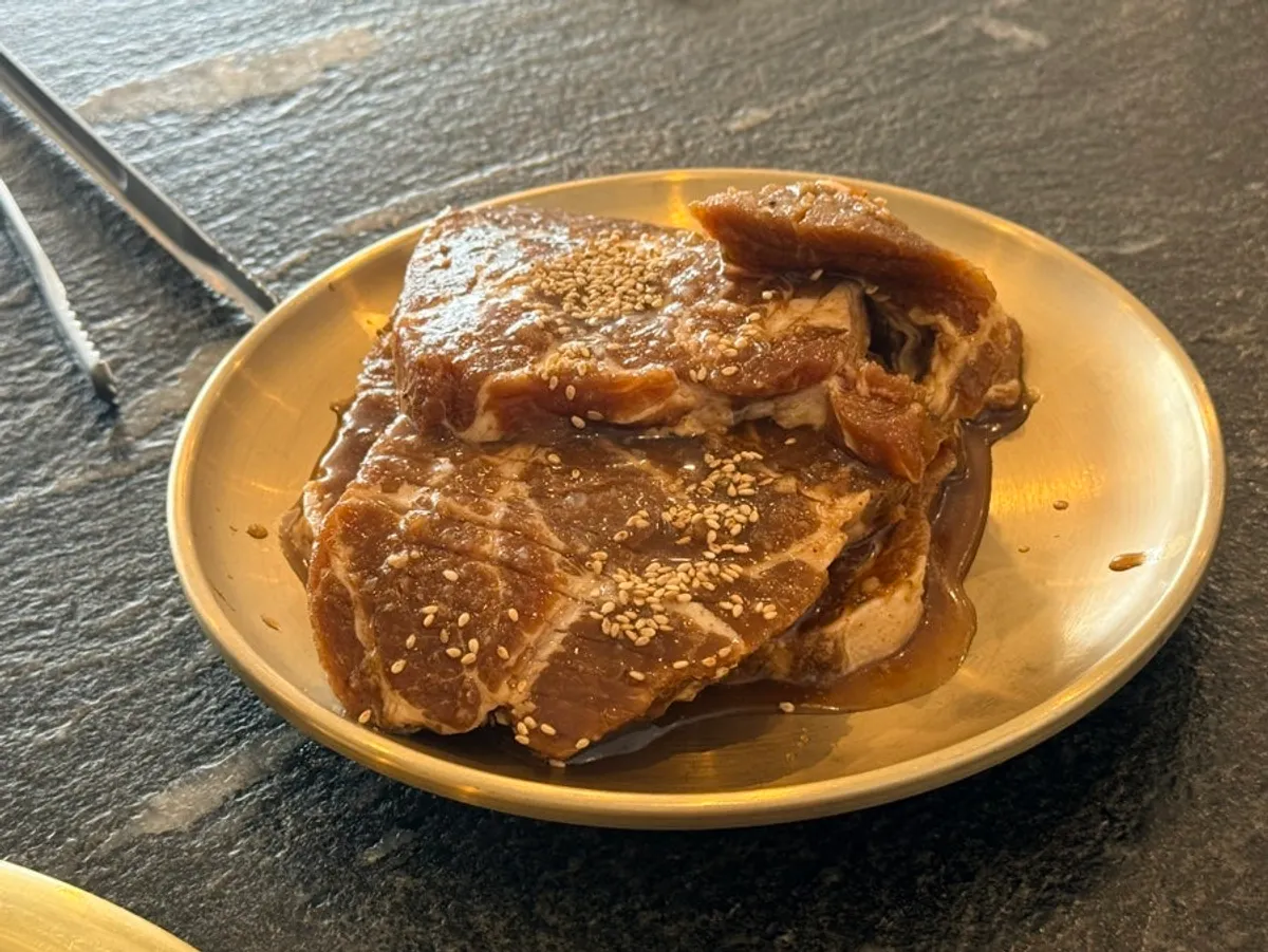 Table with two servings of pork ribs and meal dishes