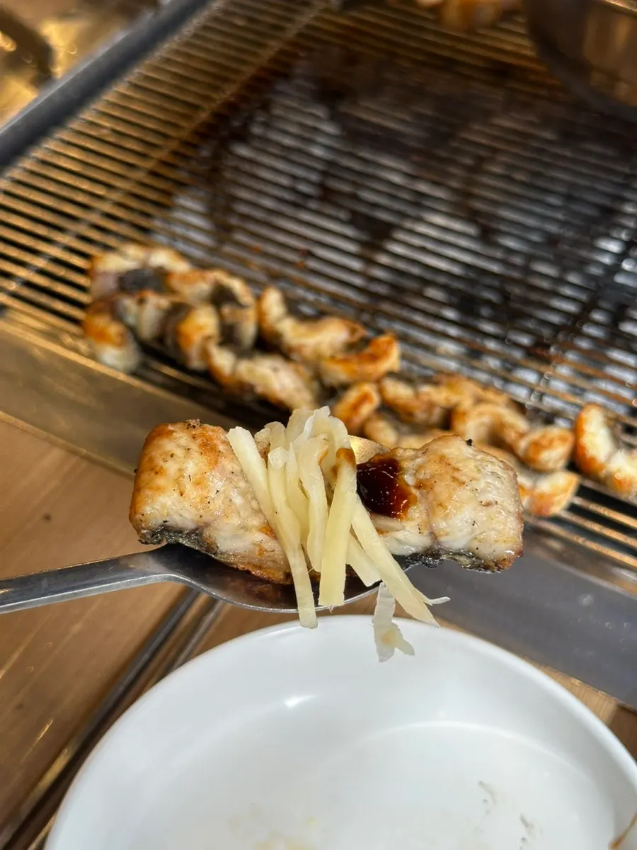Eel wrapped in a perilla leaf with ginger on top