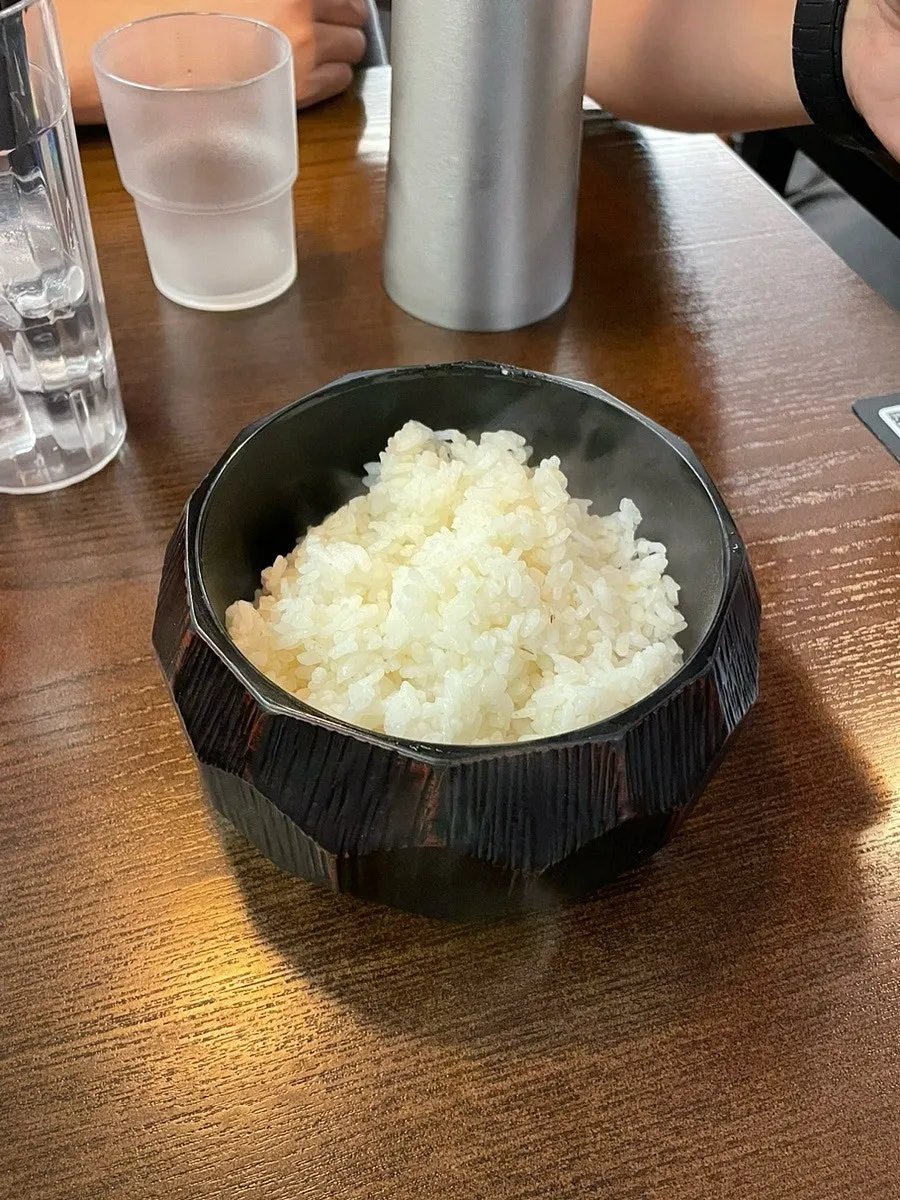 Warm rice served in a lidded bowl