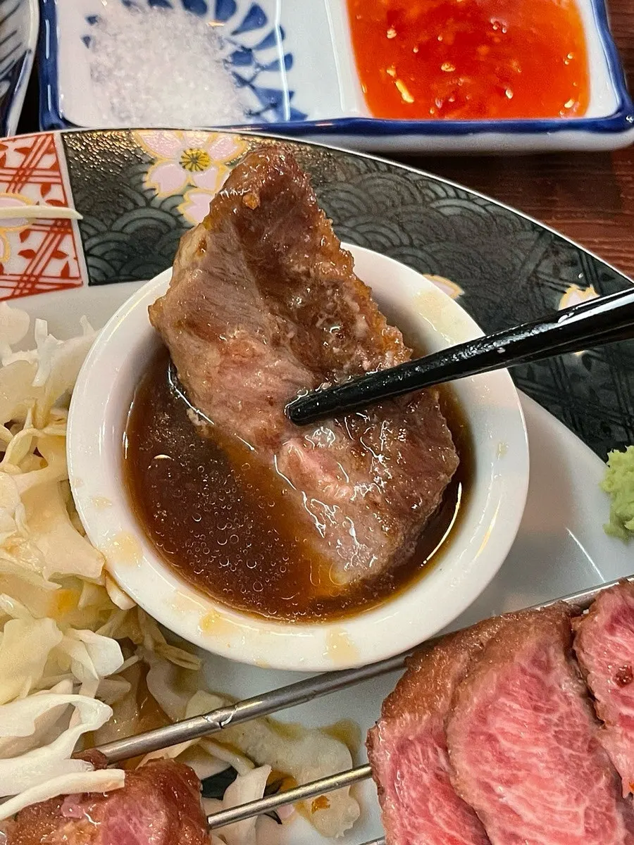 A piece of gyukatsu paired with wasabi