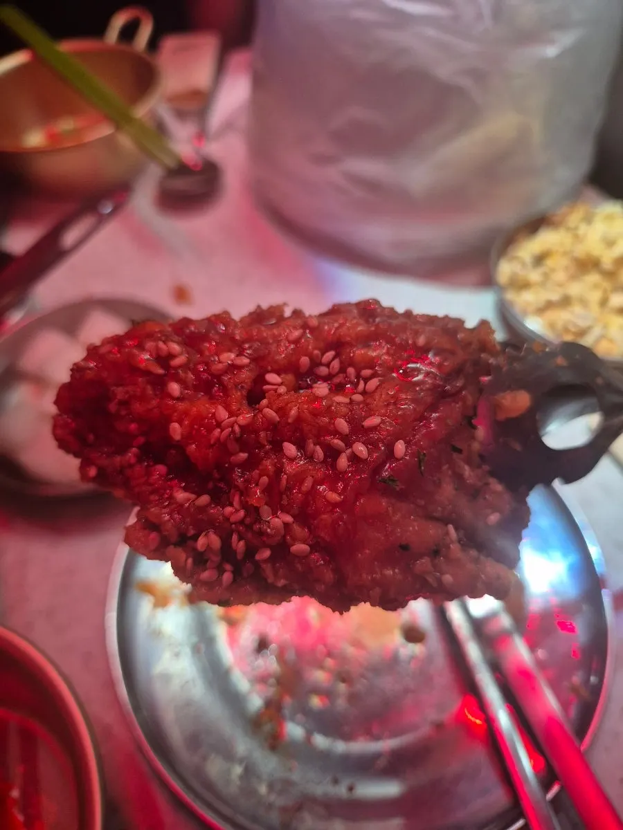 Picking up a piece of soy sauce chicken