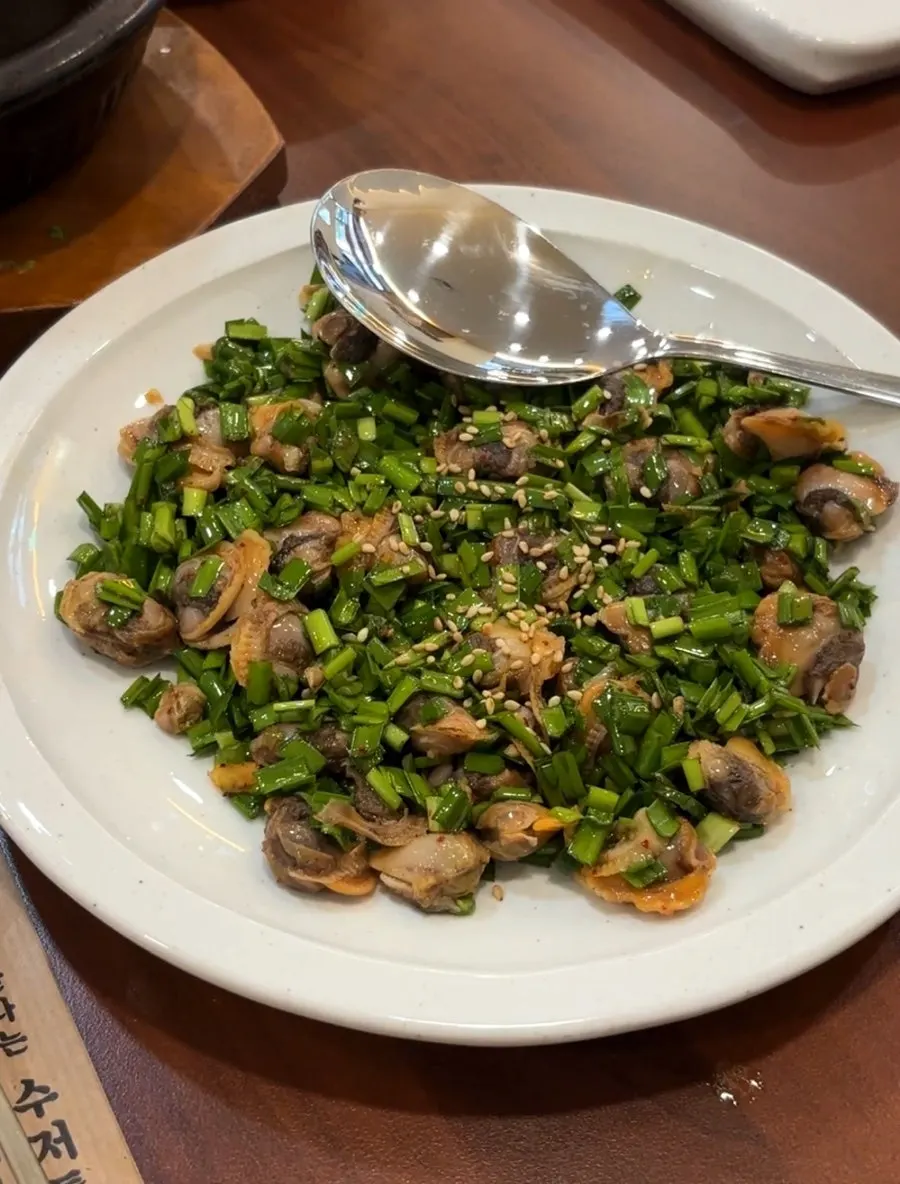 Cockle mix in soy sauce seasoning topped with chives