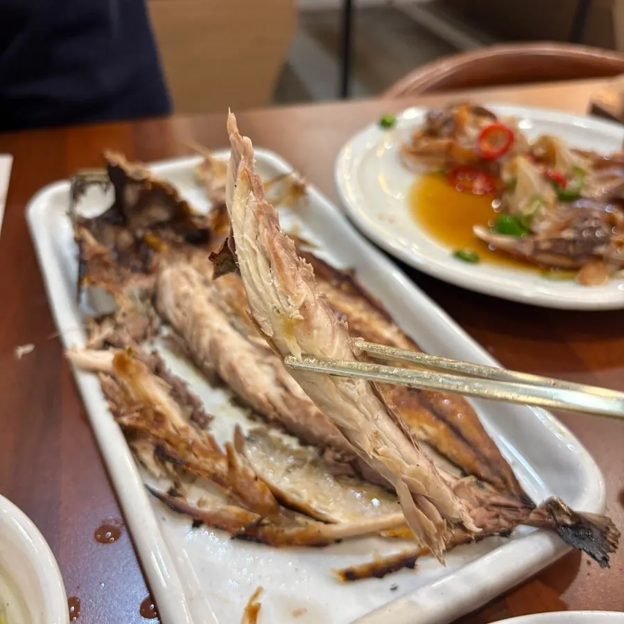 Flesh picked apart from the grilled mackerel