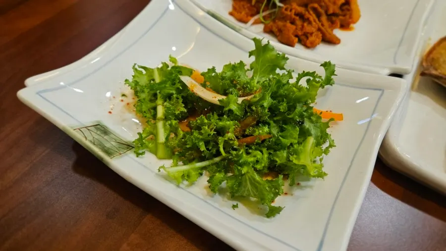 Plates of side dishes meant to be eaten with rice