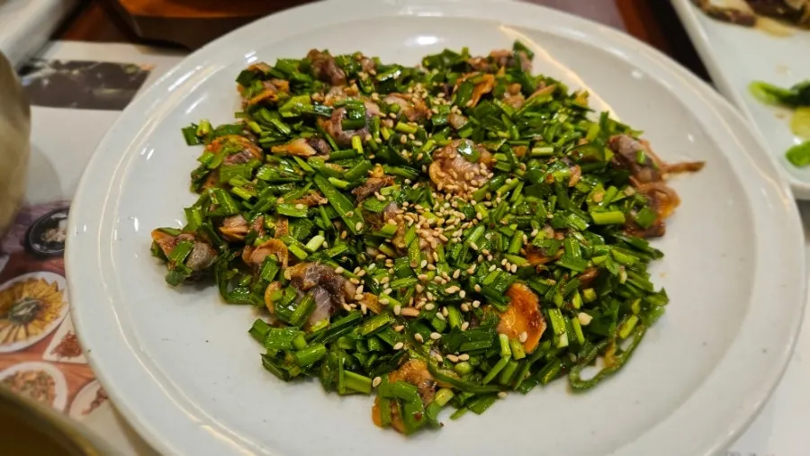 A plate of jeyuk and japchae served as standalone dishes