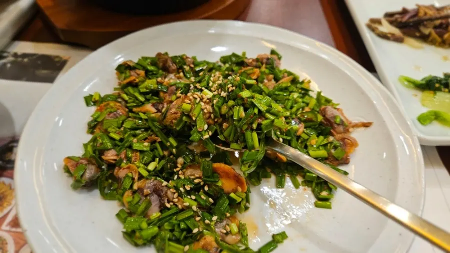 Cockles and sauce mixed into rice for the cockle bibimbap