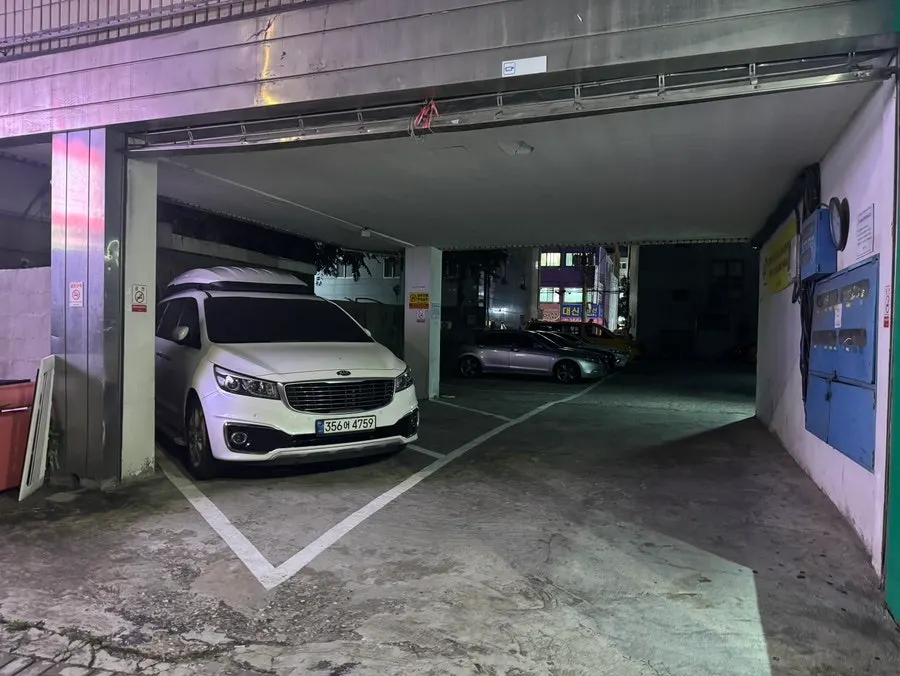 Parking space in front of the store on the first floor of Donga Building
