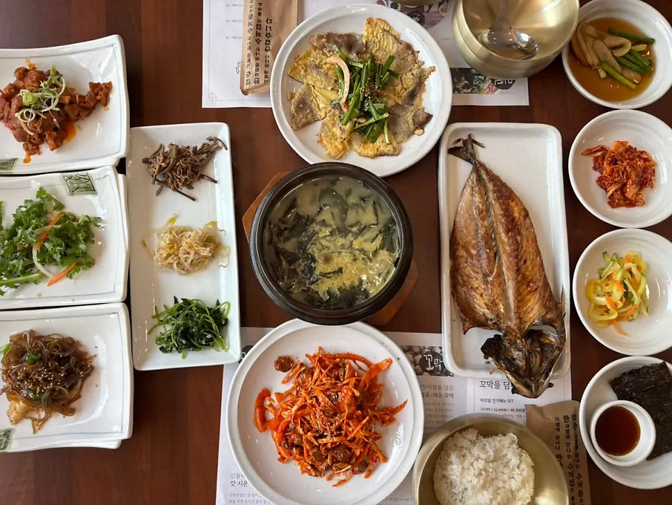 The Full Table set for two spread with side dishes
