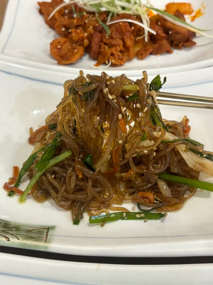 Japchae served as a side dish at Mikodam
