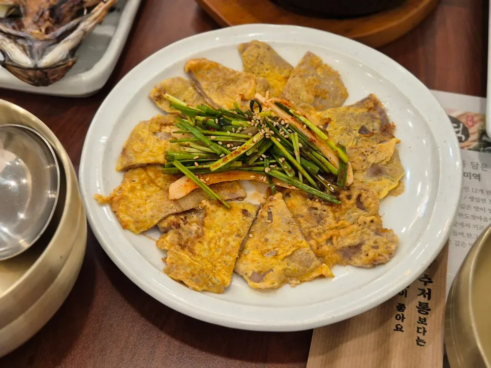 Close-up of stir-fried pork and beef jeon among the sides