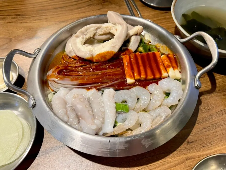 Octopus and shrimp cooking in the nakgopsae pot