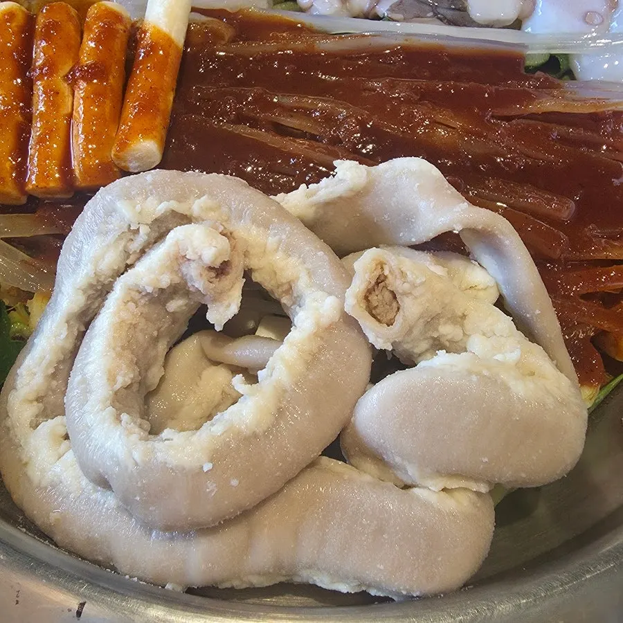 Close-up of nakgopsae with seasoning on top