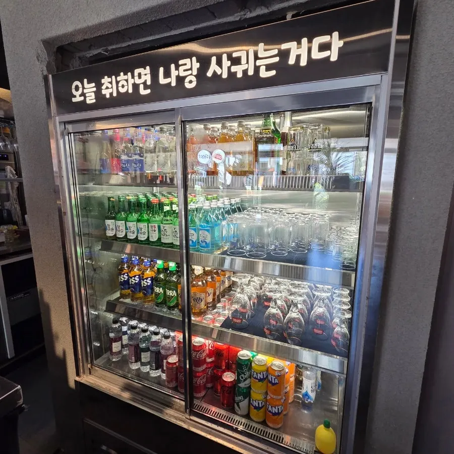 A section of the restaurant with a TV screen