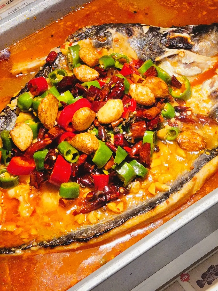 Mala garlic kaoyu covered in red chili and whole garlic