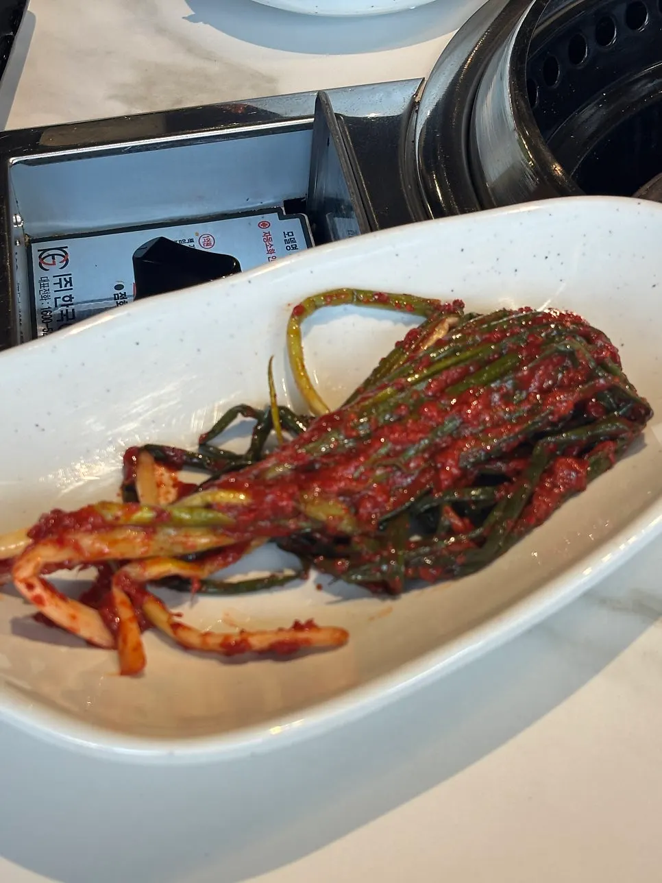 Green onion kimchi on a plate