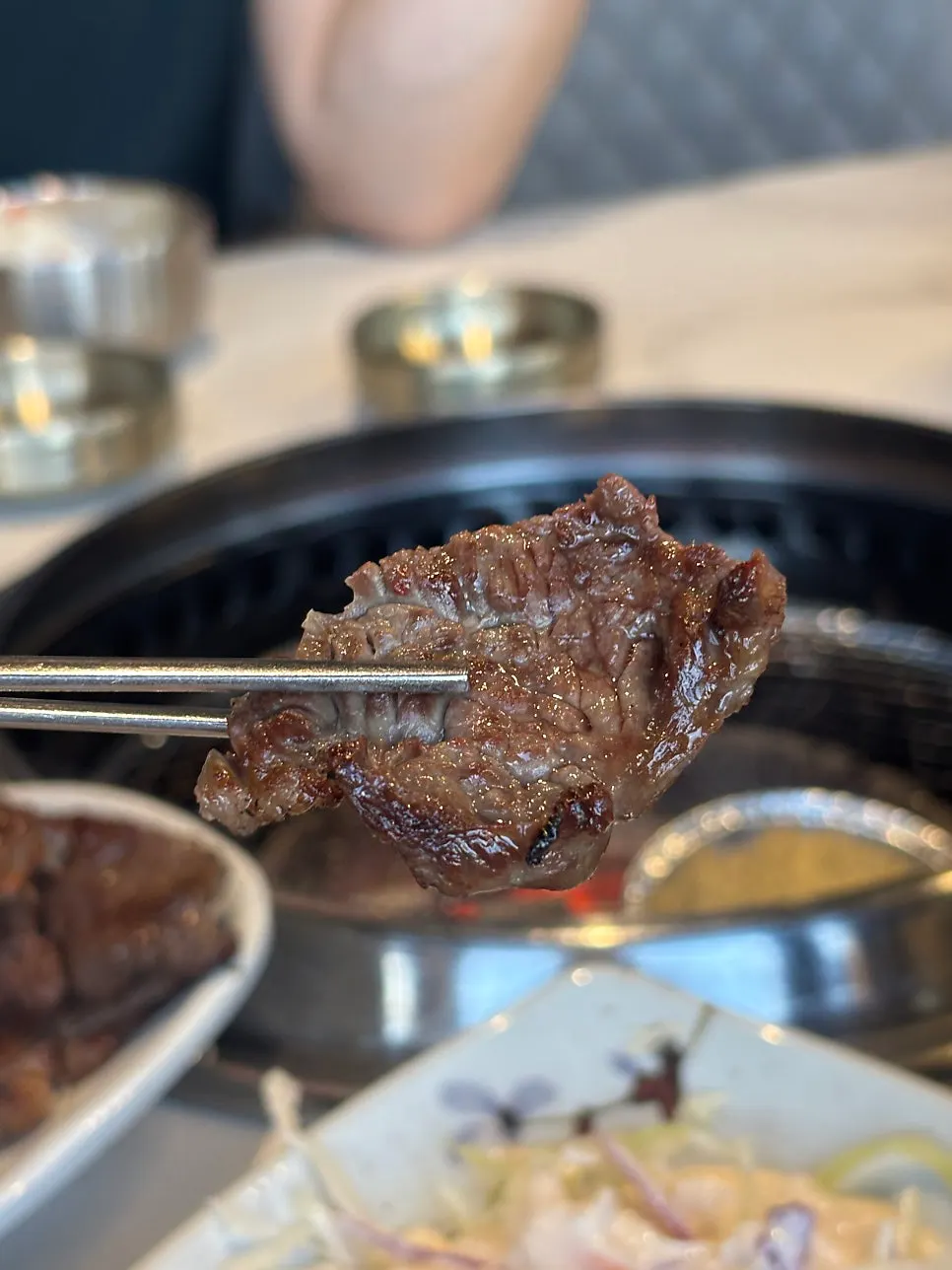 Cooked meat being moved onto a plate
