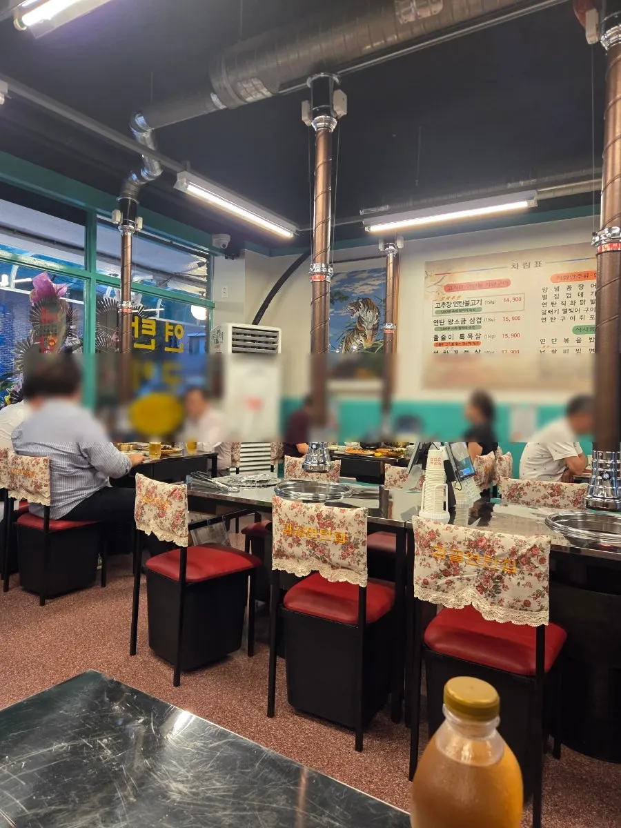 Interior of Gamgol Yeontanjip Bangbae with old-school charcoal grill vibe