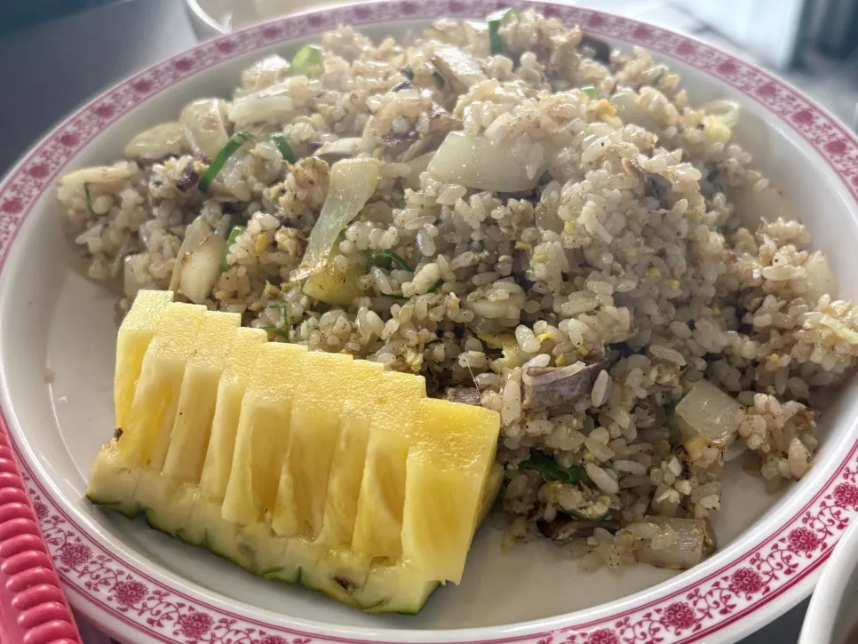 A spoonful of the pineapple fried rice