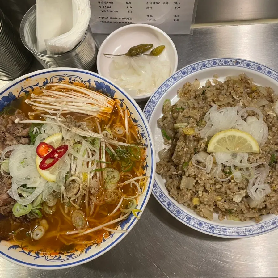 Full spread of pho and fried rice on the table