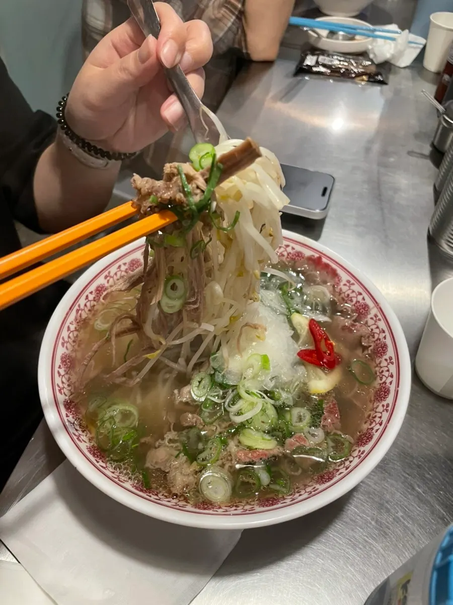 Noodles lifted from the mixed pho bowl
