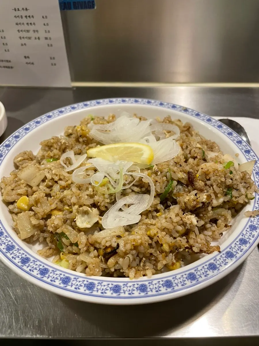 Close-up of seafood fried rice loaded with seafood