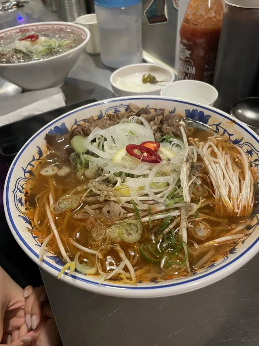 Spicy pho loaded with bean sprouts and mushrooms