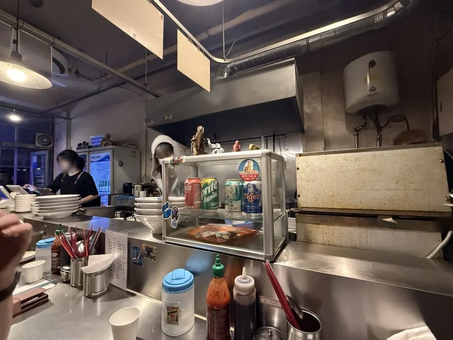 Bar-style seating wrapped around the kitchen