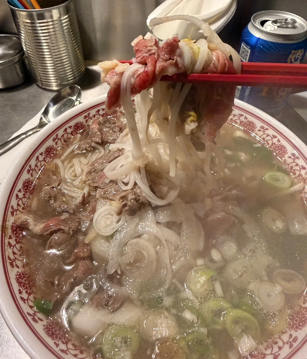 A bowl of pho piled high with fresh tenderloin
