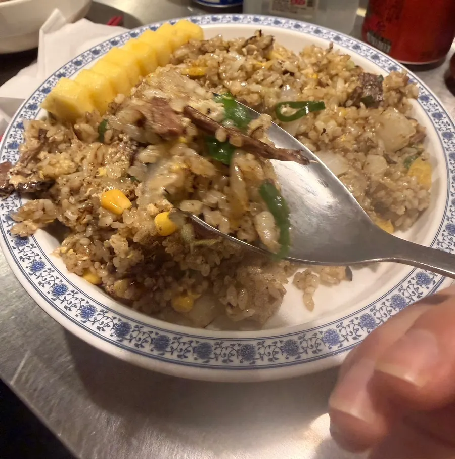 Pineapple fried rice with meat, egg, and corn