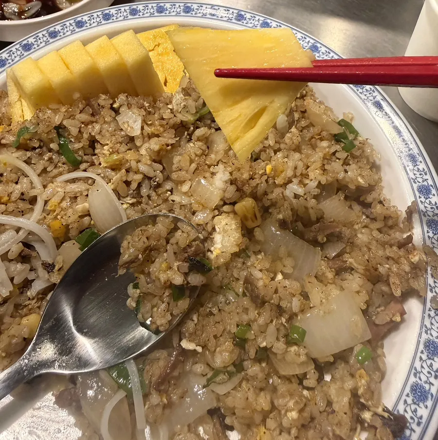 Fresh pineapple served on the side of the plate