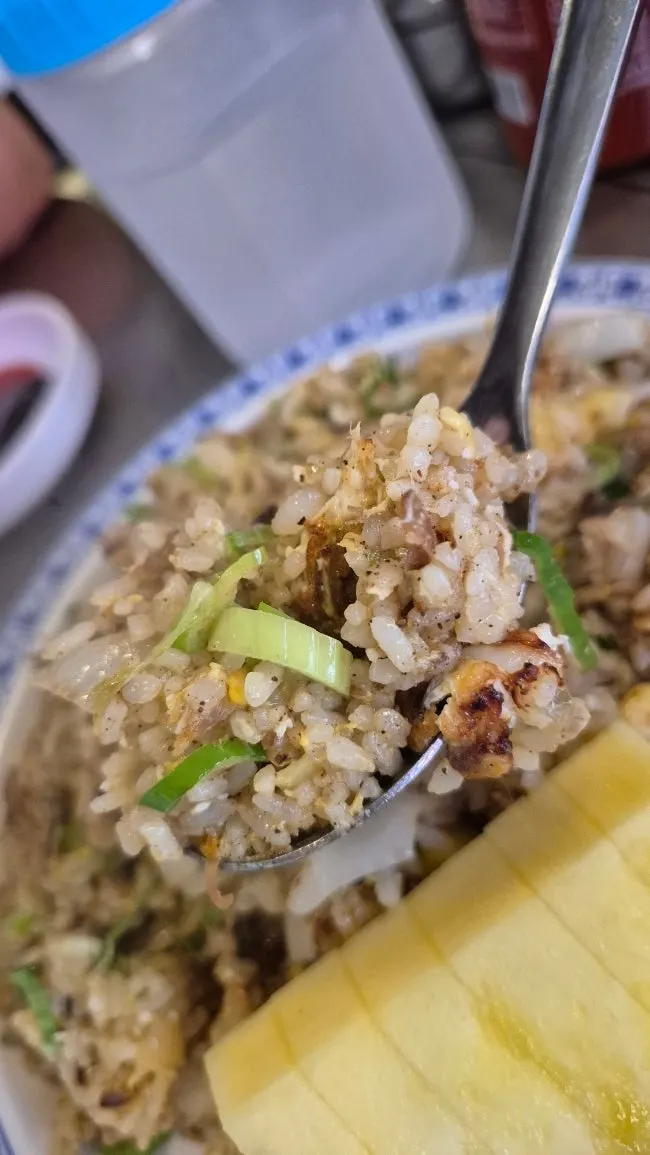 Close-up of a spoonful of pineapple fried rice