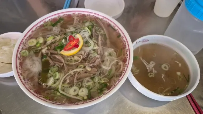 A bowl filled with rich pho broth