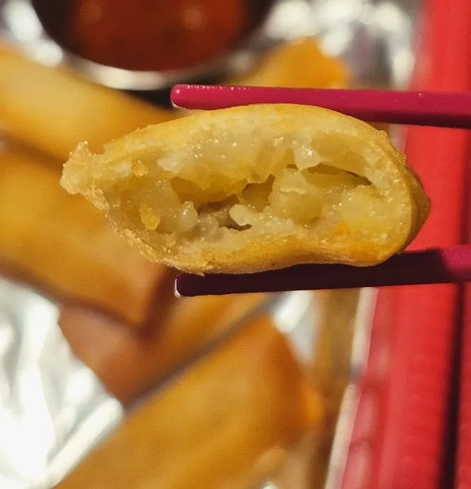 Cross-section of a crispy, juicy cha gio filled with meat