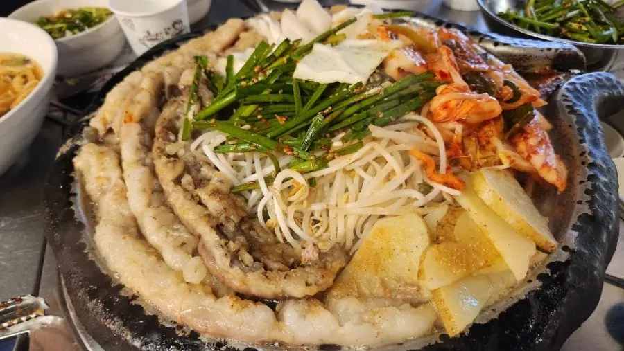 Raw beef gopchang placed on the grill