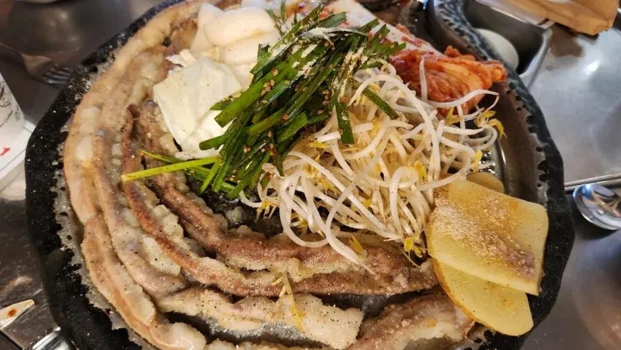 Staff grilling beef gopchang for the table