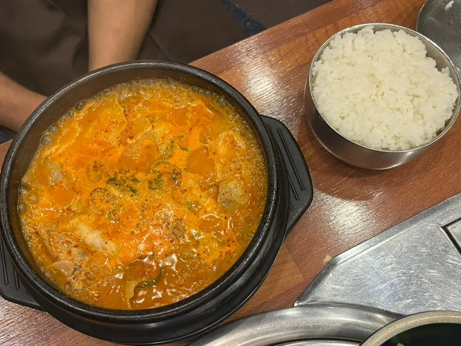 Bowl of spicy pork gukbap with red broth