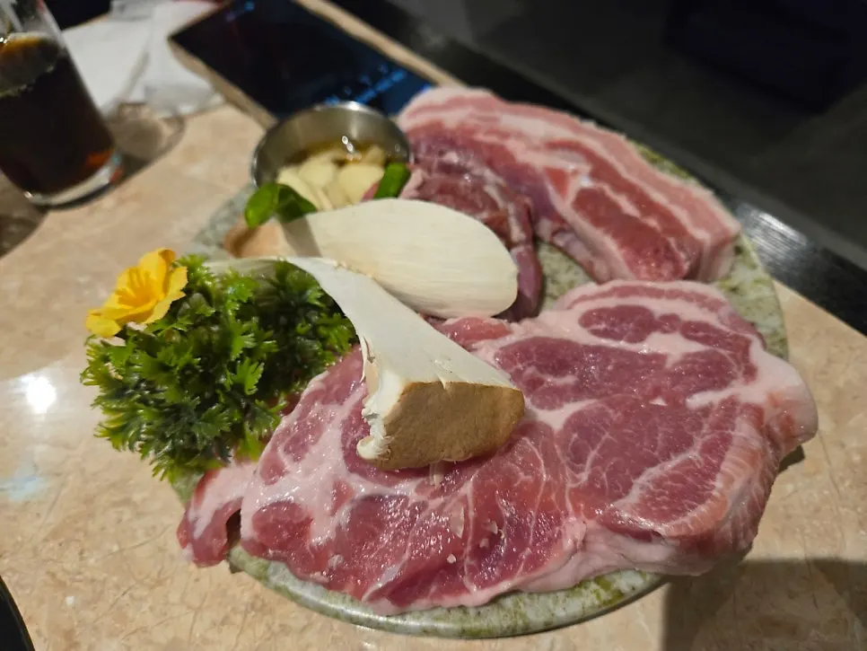 A full plate of Korean pork sampler cuts
